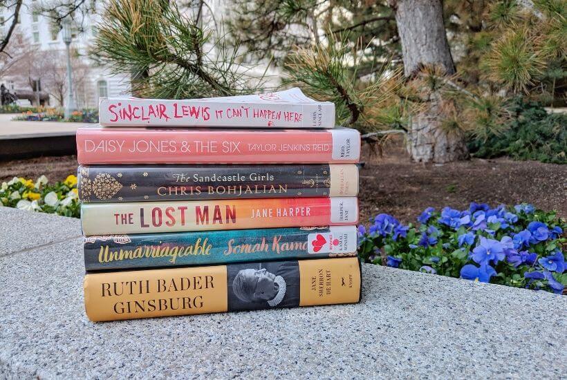 book stack It Can't Happen Here, Daisy Jones & The Six, The Sandcastle Girls, The Lost Man, Unmarriageable, Ruth Bader Ginsburg: A Life