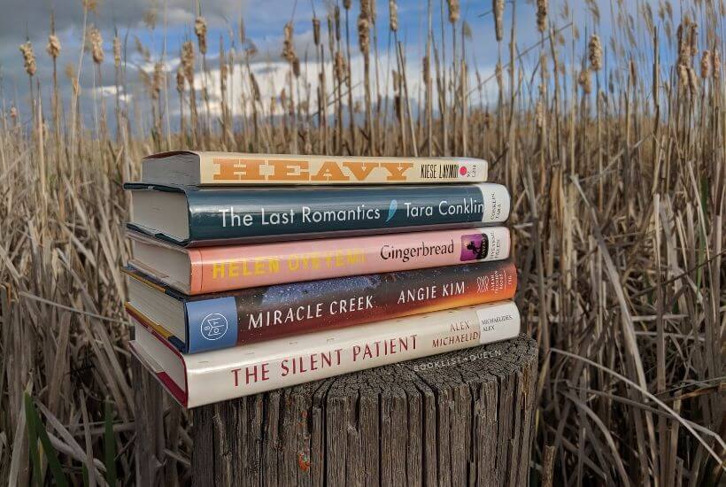 book stack in front of cattails