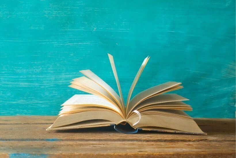 Reading Challenge 2021 - book on table with blue background